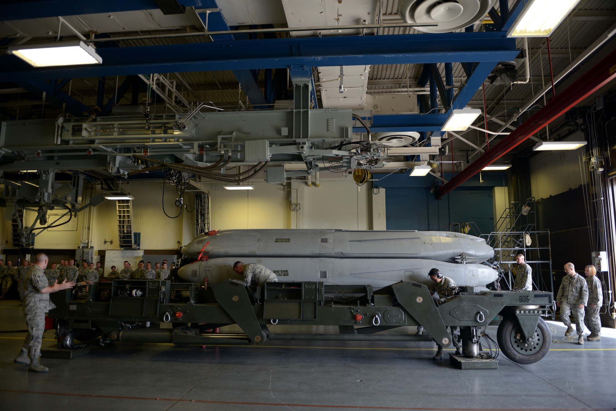 Members from the 705th Munitions Squadron conduct a mate-and-tow maneuver during Global Strike Challenge at Minot Air Force Base, N.D., June 30, 2017. The Airmen were evaluated on precision, speed and accuracy during the competition. (U.S. Air Force photo by Staff Sgt. Chad Trujillo)