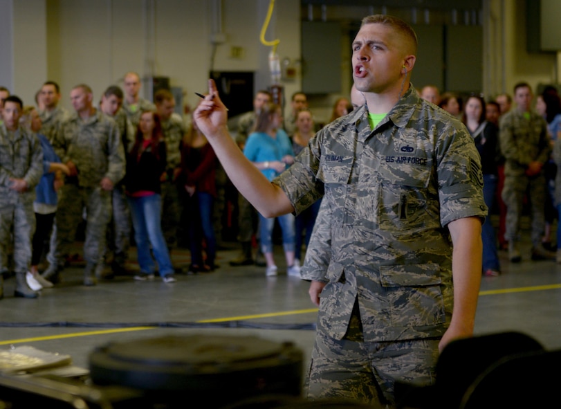 Staff Sgt. Eldin Holman, 705th Munitions Squadron weapons maintenance team chief, directs to his team during Global Strike Challenge at Minot Air Force Base, N.D., June 30, 2017. Holman and his team conduct a mate-and-tow maneuver during Global Strike Challenge 2017. (U.S. Air Force photo by Staff Sgt. Chad Trujillo)