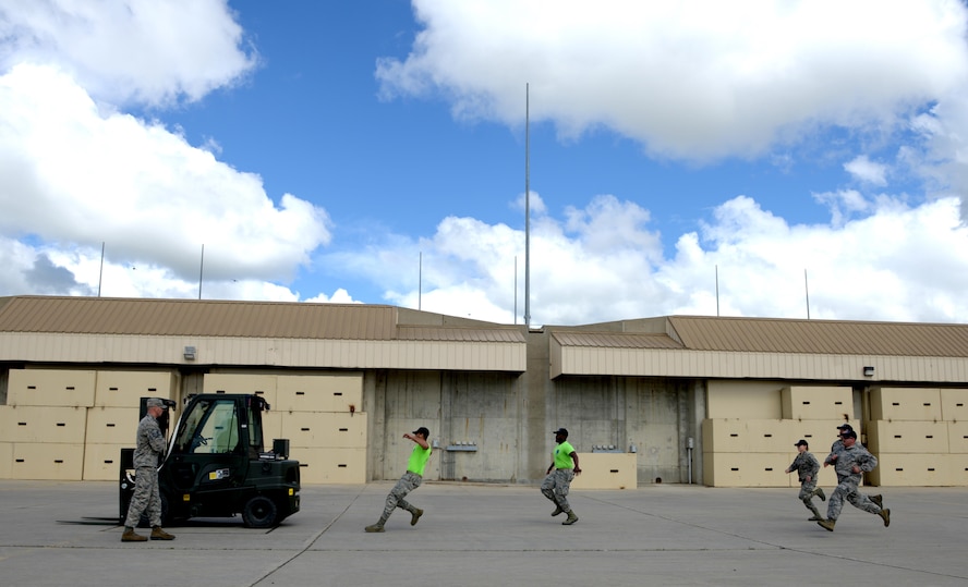 Members from the 705th Munitions Squadron kick off the forklift rodeo during Global Strike Challenge at Minot Air Force Base, N.D., June 30, 2017. The Airmen were evaluated on precision, speed and accuracy, the fork lift rodeo was one of many events during Global Strike Challenge 2017. (U.S. Air Force photo by Staff Sgt. Chad Trujillo)