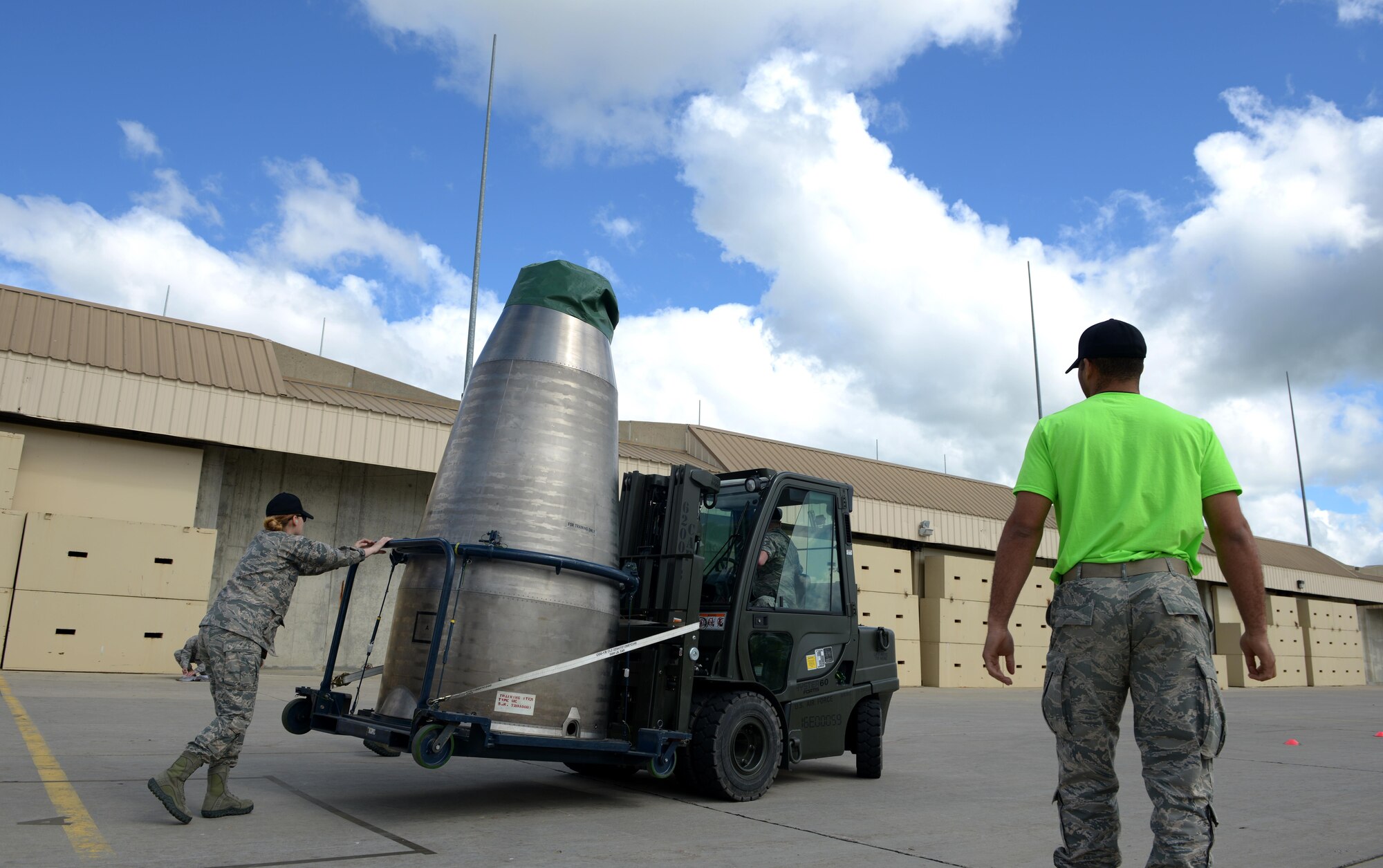 Re-entry system and re-entry vehicle maintenance members from the 705th Munitions Squadron transport an aft shroud during a forklift rodeo at Minot Air Force Base, N.D., June 30, 2017. The forklift rodeo was part of many events during Global Strike Challenge 2017. (U.S. Air Force Photo by Staff Sgt. Chad Trujillo)