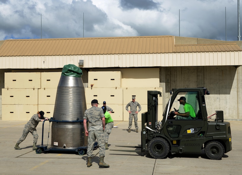Re-entry system and re-entry vehicle maintenance members from the 705th Munitions Squadron transport an aft shroud during a forklift rodeo at Minot Air Force Base, N.D., June 30, 2017. The forklift rodeo was part of many events during Global Strike Challenge 2017. (U.S. Air Force Photo by Staff Sgt. Chad Trujillo)