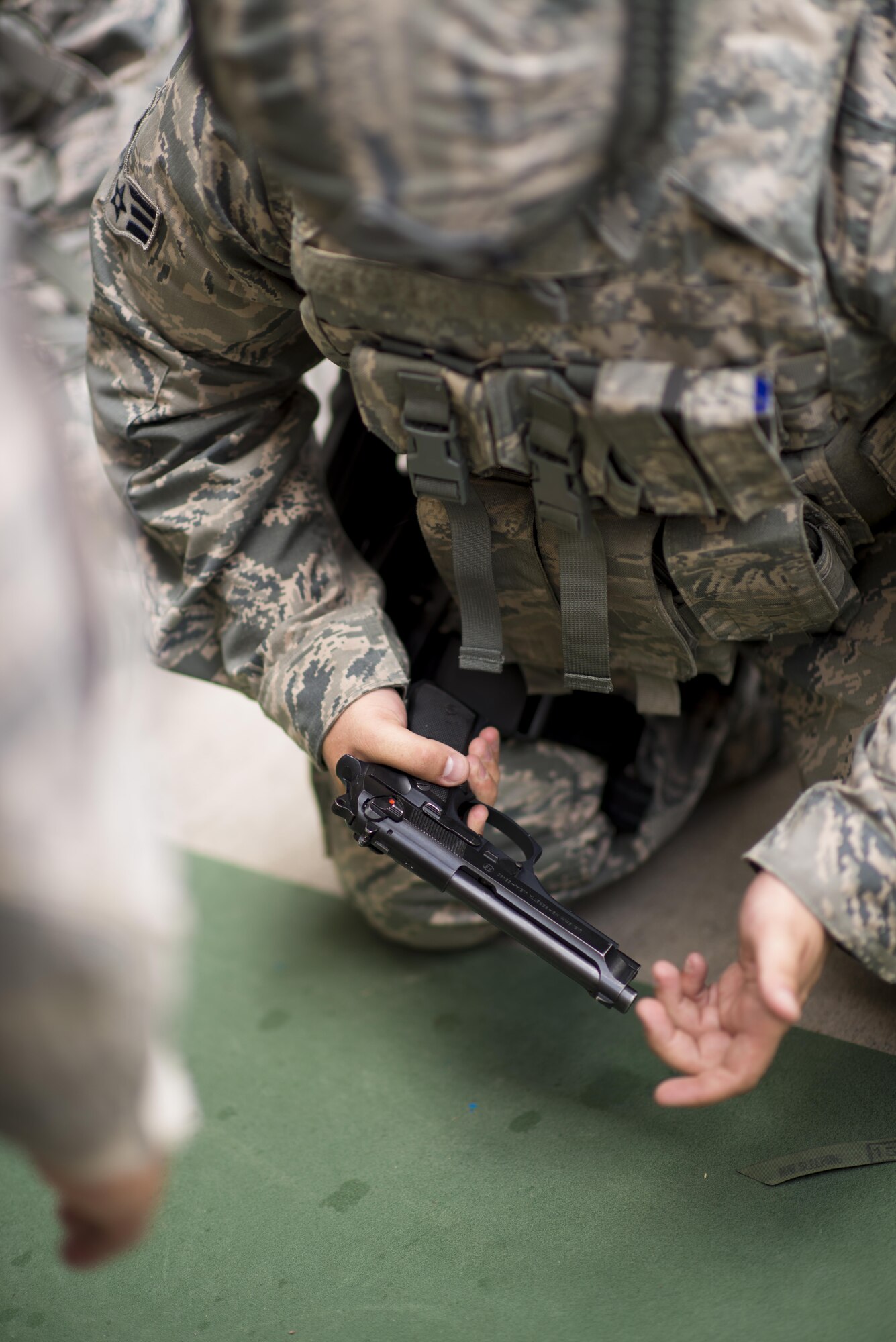 A 914th Security Forces Airman assembles an M9 pistol during Security Forces annual training, July 11, 2017, Niagara Falls Air Reserve Station, N.Y. The training focuses on communication and execution of maneuvers, ensuring SFS Airmen are well versed in smoothly and efficiently carrying out procedures in real-world situations. (U.S. Air Force photo by Tech. Sgt. Stephanie Sawyer) 