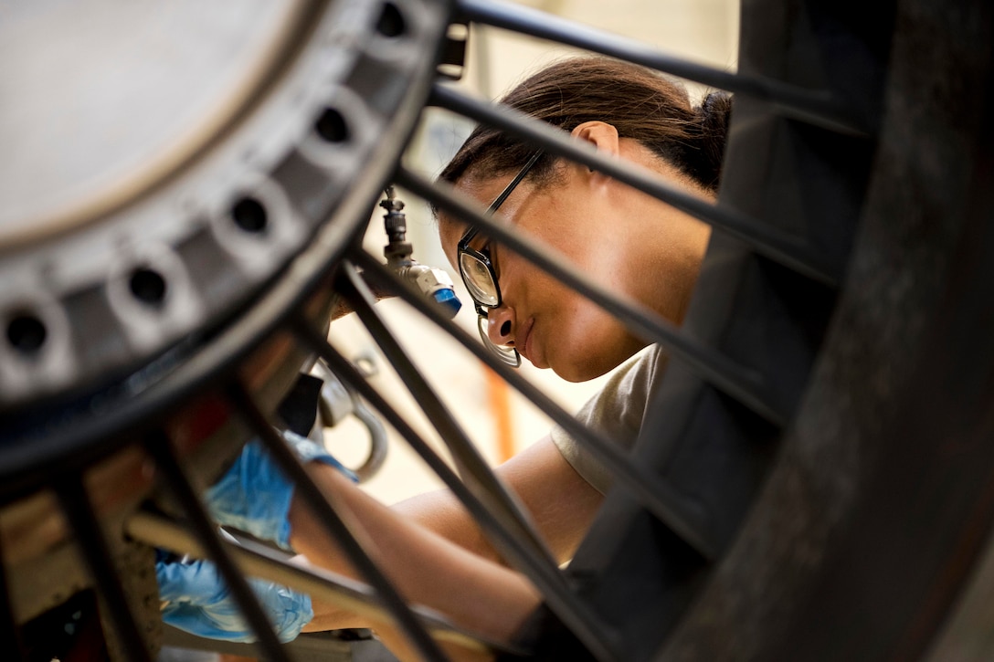 Air Force Airman 1st Class Virgen Hernandez removes the pressure switch on a TF-34 engine for inspection at Kadena Air Base, Japan, July 6, 2017. Hernandez is an aerospace propulsion apprentice assigned to the 18th Component Maintenance Squadron. Air Force photo by Senior Airman John Linzmeier