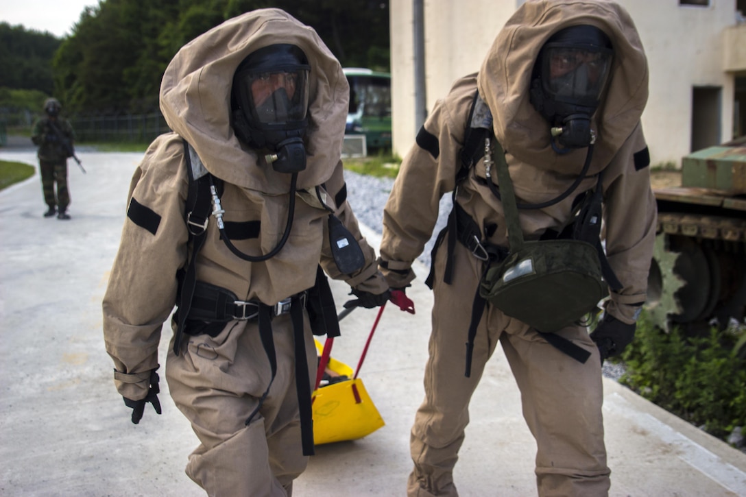 U.S. Marine Corps Lance Cpl. Andres Gomez, left, and Lance Cpl. Ivan Franck, chemical, biological, radiological and nuclear defense specialists, move a simulated casualty toward the decontamination center during an exercise in Pohang, South Korea, July 3, 2017. Marine Corps photo by Lance Cpl. Andy Martinez
