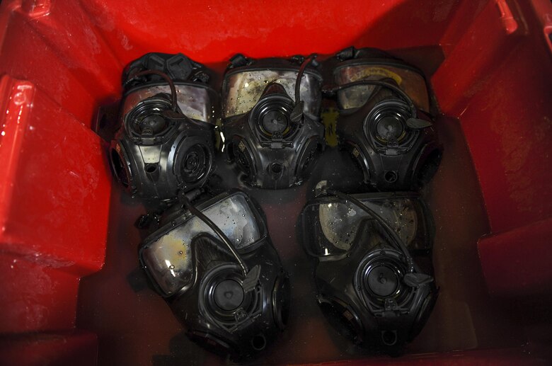 Gas masks soak in a cleaning solution at Hurlburt Field, Fla., July 10, 2017. Materiel management specialists with the 1st Special Operations Logistics Readiness Squadron use a chlorine solution to wash the gas masks, which are then rinsed in water and set to dry overnight. Once dry, a Joint Service Mask Leakage Tester is used to check for leaks or blocks in the masks. (U.S. Air Force photo by Airman 1st Class Isaac O. Guest IV)