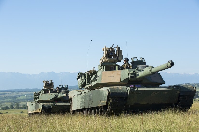 U.S. soldiers with the 1st Battalion, 66th Armor Regiment, 3rd Armored Brigade Combat Team, 4th Infantry Division, maneuver tanks during Getica Saber 2017 in Cincu, Romania, July 10, 2017. Getica Saber 2017 is a U.S.-led fire support coordination exercise and combined arms live fire exercise that incorporates six allied and partner nations with more than 4,000 soldiers. Getica Saber 2017 runs concurrent with Saber Guardian 17, a U.S. Army Europe-led, multinational exercise that spans across Bulgaria, Hungary and Romania with over 25,000 service members from 22 Allied and partner nations. Army photo by Spc. Antonio Lewis