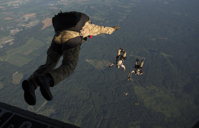 Special Tactics Airmen with the 123rd Special Tactics Squadron, Louisville, KY., execute a high altitude, low open jump out of a 15th Special Operations Squadron MC-130H Combat Talon II, during a total force exercise mission over Terra Haute, Ind., July 8, 2017.  Air Commandos with the 1st Special Operations Wing conduct exercises with joint services to strengthen the development of joint leaders and teams to better understand the synergy of air, space, and cyber power, and how to synthesize the capabilities the air component brings with the other elements of joint and national power. (U.S. Air Force photo by Tech. Sgt. Jeffrey Curtin)