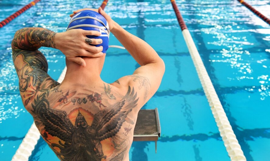 U.S. Air Force veteran Rob Scoggins, a former combat rescue helicopter pilot from Manitou Springs, Colo., adjusts his swim cap moments before the men’s 50-meter free style July 8, 2017 at the University of Illinois at Chicago, Chicago, Ill. Scoggins became increasingly emotional, avoidant and while facing his struggle with posttraumatic stress disorder. (U.S. Air Force photo by Staff Sgt. Chip Pons) 