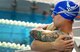 U.S. Air Force veteran Rob Scoggins, a former combat rescue helicopter pilot from Manitou Springs, Colo., takes a moment to stretch before his race at the 2017 Department of Defense Warrior Games July 8, 2017 at the University of Illinois at Chicago, Chicago, Ill. Scoggins suffered from posttraumatic stress disorder and a traumatic brain injury before being medically separated from active duty. (U.S. Air Force photo by Staff Sgt. Alexx Pons)