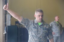 Staff Sgt. Eldin Holiman, 705th Munitions Squadron maintenance team lead, gives a thumbs up during trailer operations at Minot Air Force Base, N.D., June 30, 2017. Holiman is a 705th MUNS 2017 Global Strike Challenge team member. (U.S. Air Force photo by Airman 1st Class Jessica Weissman)