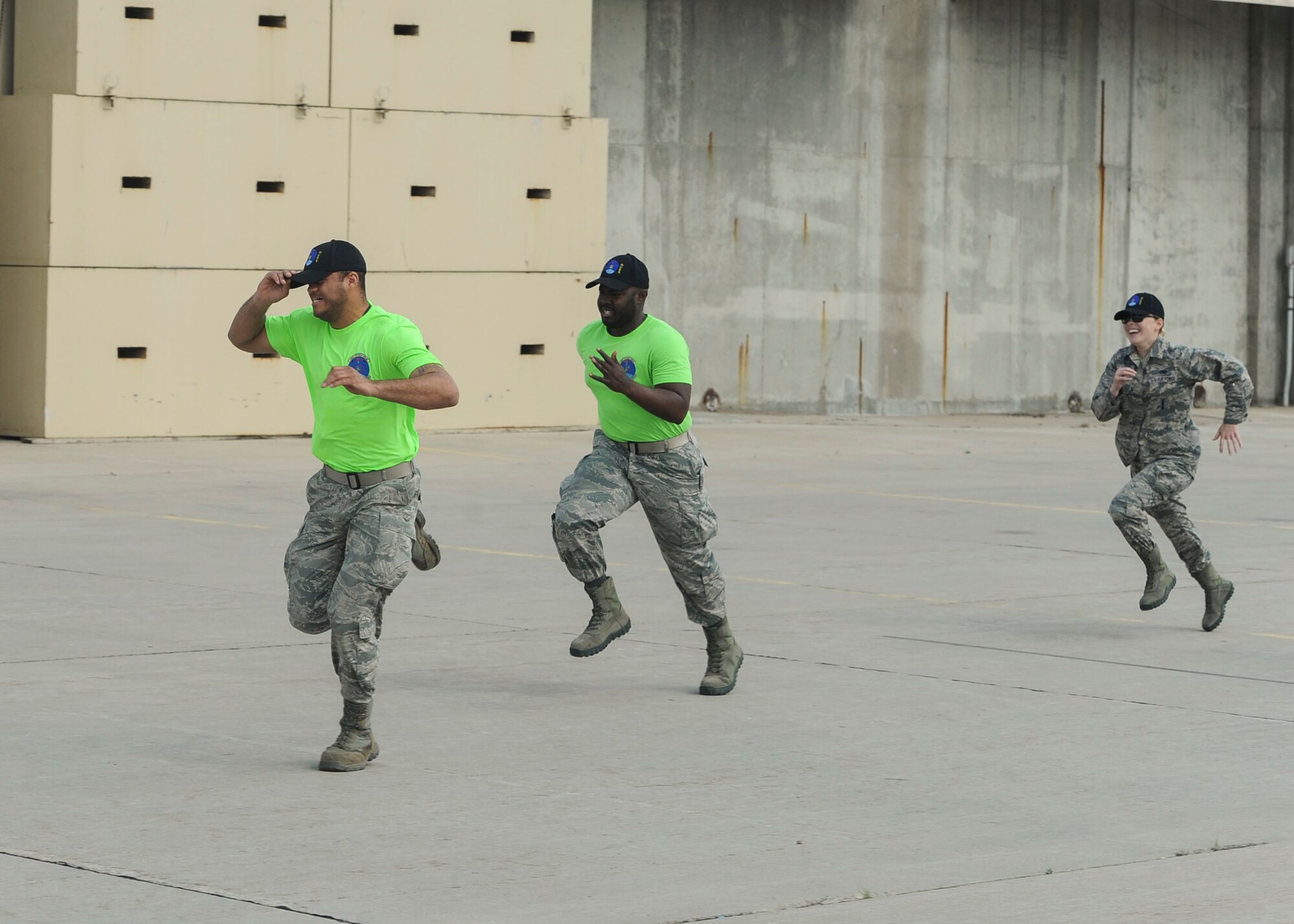 Members from the 705th Munitions Squadron Global Strike Challenge team run to their vehicle during a practice competition at Minot Air Force Base, N.D., June 30, 2017. The team completed a “forklift rodeo” by maneuvering an asset with a forklift. (U.S. Air Force photo by Airman 1st Class Jessica Weissman)