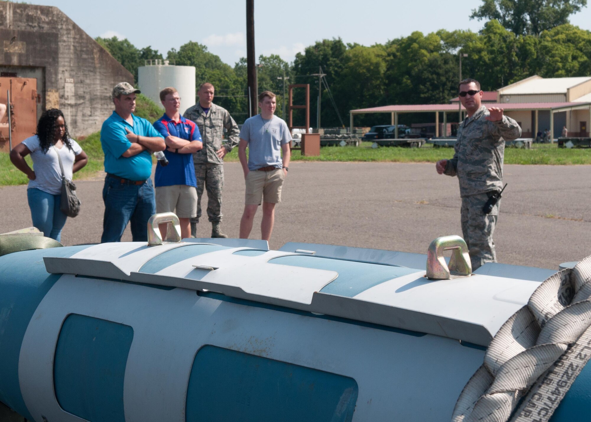Senior Master Sgt. Ryan Meaux, Munitions Production superintendent assigned to the 307th Maintenance Squadron, shows a variety of munitions for the B-52 Stratofortress to the family and friends of future Airmen assigned to the Development and Training Flight at Barksdale Air Force Base, La. July 9, 2017. The D&TF prepares delayed enlistees for Basic Military Training and introduces them to the Air Force Reserve. (U.S. Air Force photo by Tech. Sgt. Cody Burt/Released)