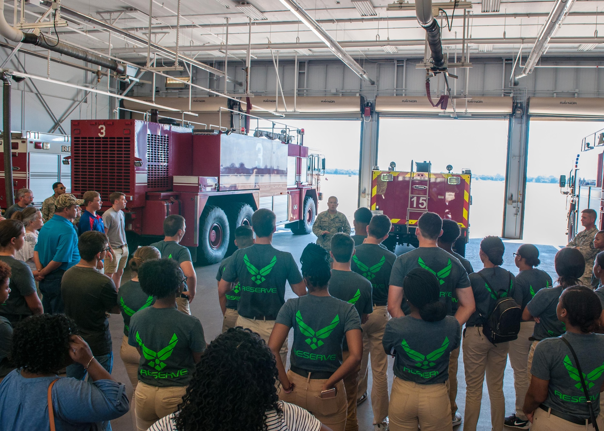 Staff Sgt. Jordan Mahaney, a firefighter assigned to the 307th Civil Engineer Squadron, highlights to future Airmen of the Development and Training Flight along with their family and friends the main fire station on Barksdale Air Force Base, La. July 9, 2017. Mahaney also talked to the group about the required to become a firefighter in the Air Force. (U.S. Air Force photo by Tech. Sgt. Cody Burt/Released)