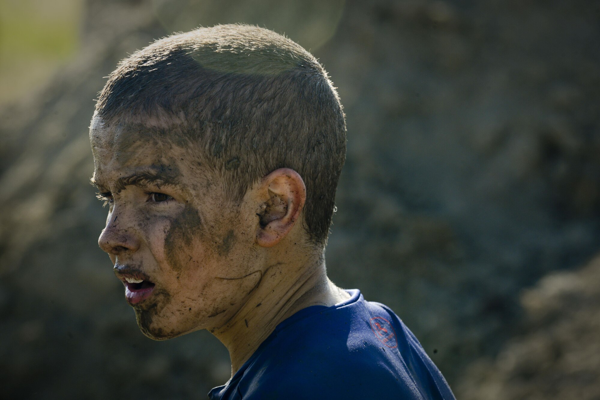 Adam Barrington prepares for an obstacle during the 2017 Mud Like You Mean It race at Minot Air Force Base, N.D., July 7, 2017. The event consisted of various obstacles that challenged their ability to crawl, climb, run and slide through mud and water. (U.S. Air Force photo by Senior Airman Sahara L. Fales)