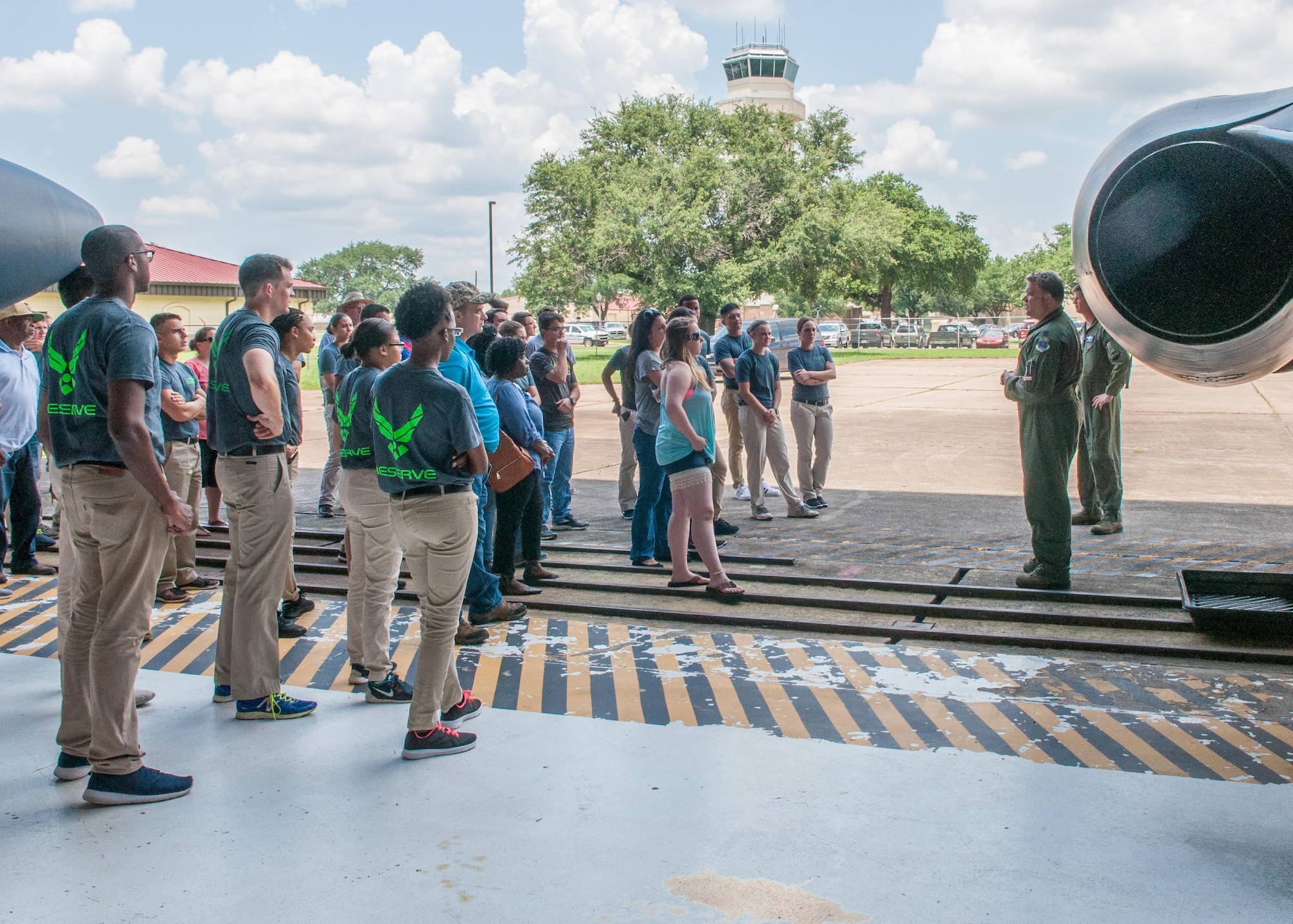 Lt. Col. Anthony Fyke and Lt. Col. Kevin Smith, both assigned to the 93rd Bomb Squadron, show off the B-52 Stratofortress, to future Airmen assigned to the 307th Bomb Wing Development and Training Flight during a base tour with their family and friends on Barksdale Air Force Base, La. July 9, 2017. The D&TF got an up-close and personal look at the Reserve bomber that they will be supporting after attending Basic Military Training and technical school. (U.S. Air Force photo by Tech. Sgt. Cody Burt/Released)