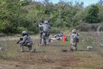 U.S. Air Force Airmen from the 644th Combat Communications Squadron captures an Airman acting as an opposing force during exercise Dragon Forge June 15, 2017, at Andersen South, Guam. Opposing forces repeatedly attacked the base throughout the day prior to an all-out final attack from all sides with the goal of overrunning the base. 