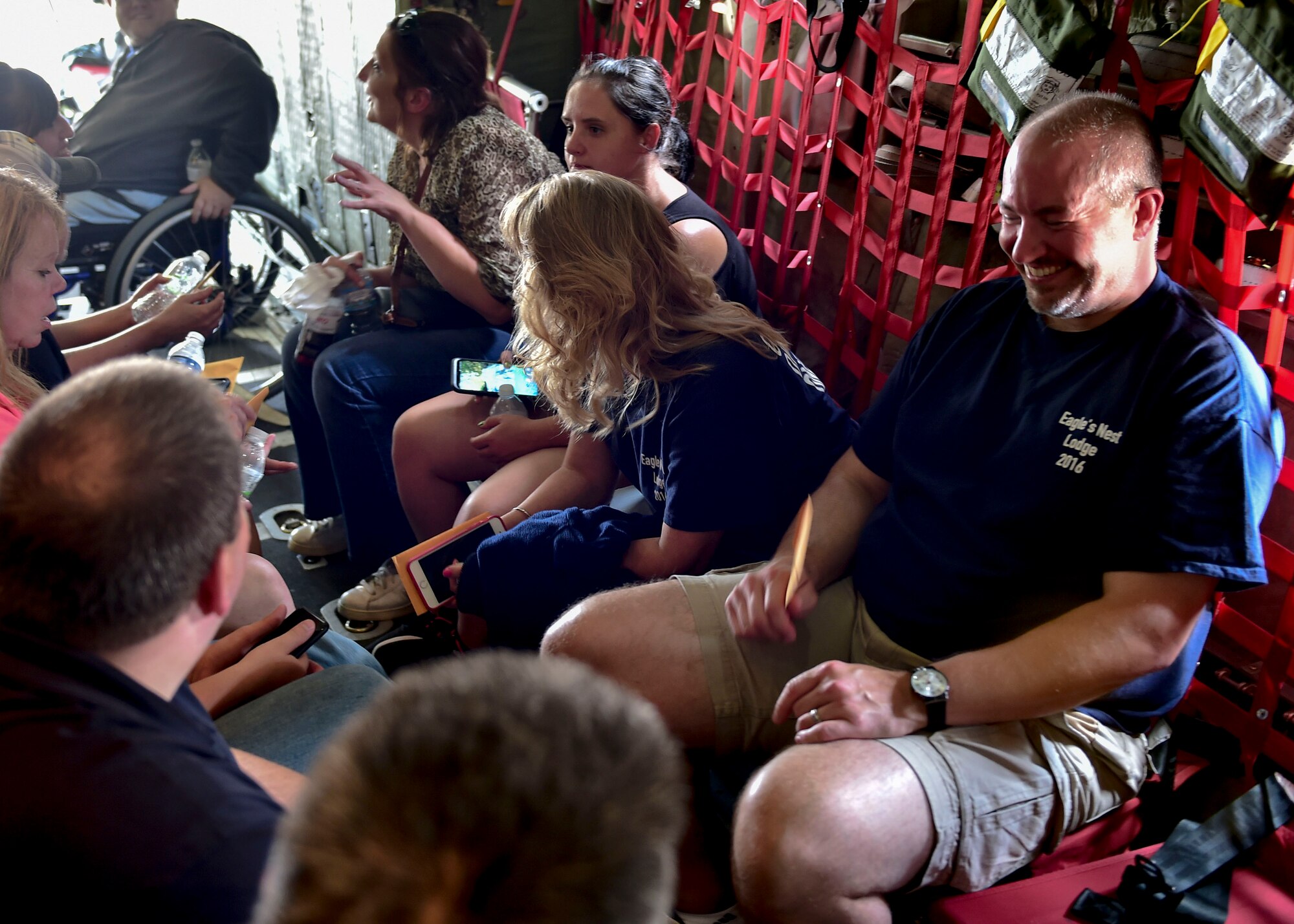 Jason Cohol, a lodging supply technician with the Force Support Squadron here, laughs after landing in a C-130H Hercules during an incentive flight July 12, 2017. Cohol has flown only once before in a C-130 during his 12 years at YARS. (U.S. Air Force Photo/Senior Airman Jeffrey Grossi)