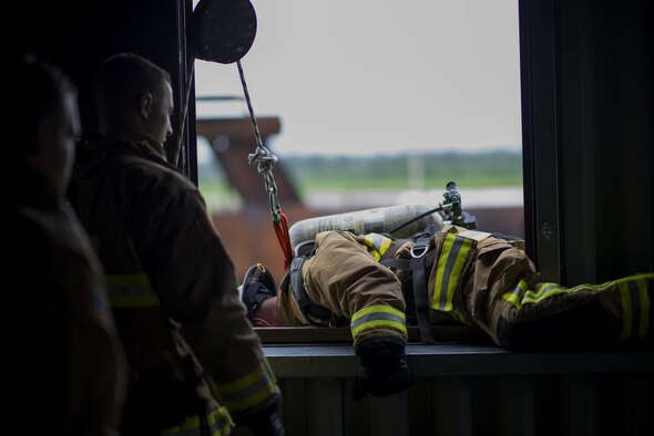 An Air Force Firefighter bails out of a second story window during a 5 day training course hosted by Niagara Falls Air Reserve Station, N.Y., July 12, 2017. Participants come from McGuire-Dix-Lakehurst, Fairchild, Dover, MacDill, and Grissom as well as Niagara. The course offers hands-on training for emergency situations in preparation of real-world situations. (U.S. Air Force photo by Tech. Sgt. Stephanie Sawyer)  

