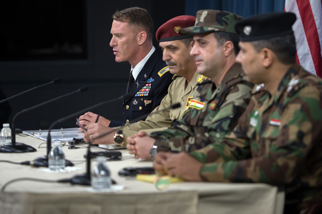 Operation Inherent Resolve spokesman Army Col. Ryan Dillon, left, and spokesmen for the Iraqi security forces brief members of the media on the Liberation of Mosul at the Pentagon, July 13, 2017. DoD photo by Army Sgt. Amber I. Smith