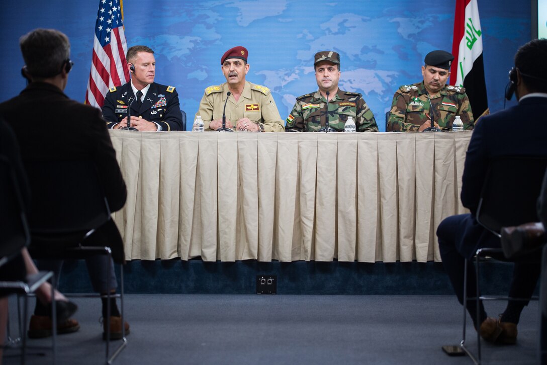 Operation Inherent Resolve spokesman Army Col. Ryan Dillon, left, and spokesmen for the Iraqi security forces brief members of the media on the Liberation of Mosul at the Pentagon, July 13, 2017. DoD photo by Army Sgt. Amber I. Smith