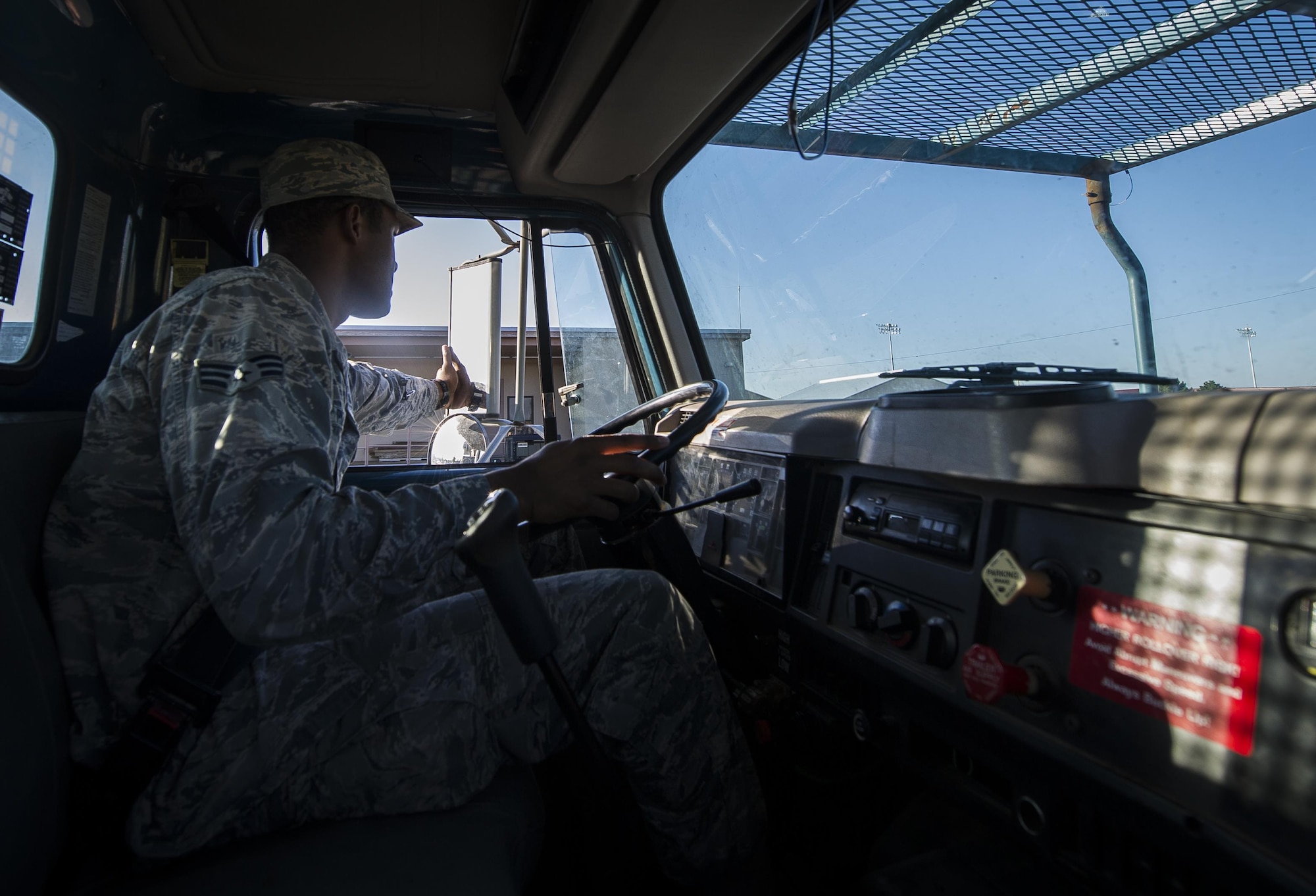 Senior Airman Darren Pizarro, 27th Special Operations Civil Engineer Squadron electrical systems specialist, drives his work truck to the next work site at Cannon Air Force Base, N.M., June 27, 2017. Pizarro and his peers at the base electrical shop have already handled over 600 requests this year. (U.S. Air Force photo by Senior Airman Lane T. Plummer)