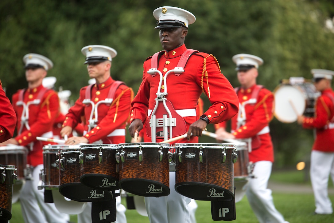 Lance Cpl. Kei Harvin, drum line, “The Commandant’s Own” U.S. Marine Drum & Bugle Corps, performs during a Tuesday Sunset Parade at the Marine Corps War Memorial, Arlington, Va., July 11, 2017. The guest of honor for the parade was the Honorable Gerald Moran, U.S. Senator from Kansas, and the hosting official was Lt. Gen. Michael Dana, deputy commandant, Installations and Logistics. The parade featured noncommissioned officers in positions traditionally held by officers and staff noncommissioned officers such as parade staff and platoon and company leadership.