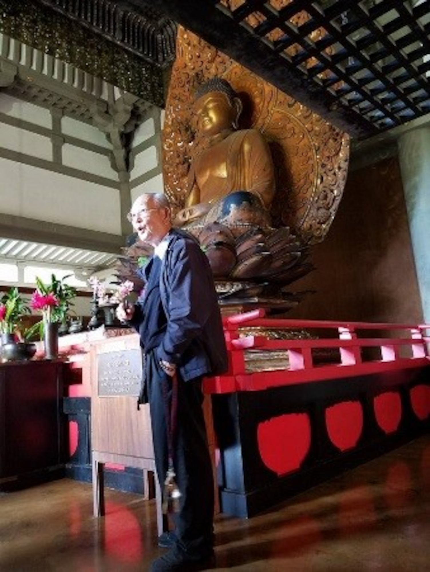 Bishop Fukuhara speaks to the Airmen of the 692nd Intelligence Surveillance Recognizance Group about the Buddhist faith and his personal experiences and spiritual journey in Phoenix Hall of the Byodo-in Temple. (Courtesy photo by Chaplain (Capt.) Ryan Ayers)