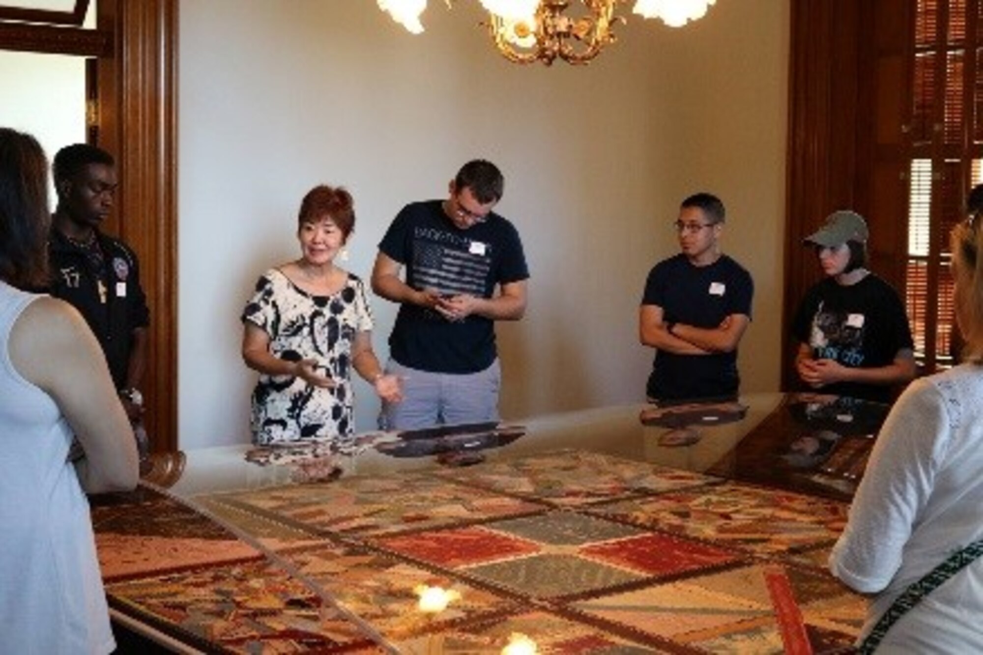 A personal tour Guide takes members of the 692nd Intelligence Surveillance Recognizance Group through the Iolani Palace during a tour for the Spiritual Enlightenment Series event. (Courtesy photo by Staff Sgt. Bradley Whitehouse)