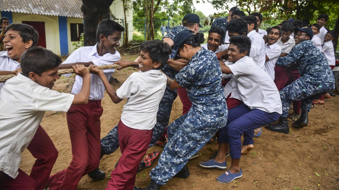 Sailors participate in a tug-of-war match with students from a secondary school in Chennai, India, July 12, 2017. The sailors, assigned to the Nimitz Carrier Strike Group, are participating in Exercise Malabar 2017 with Indian and Japanese forces. Navy photo by Petty Officer 2nd Class Erickson B. Magno