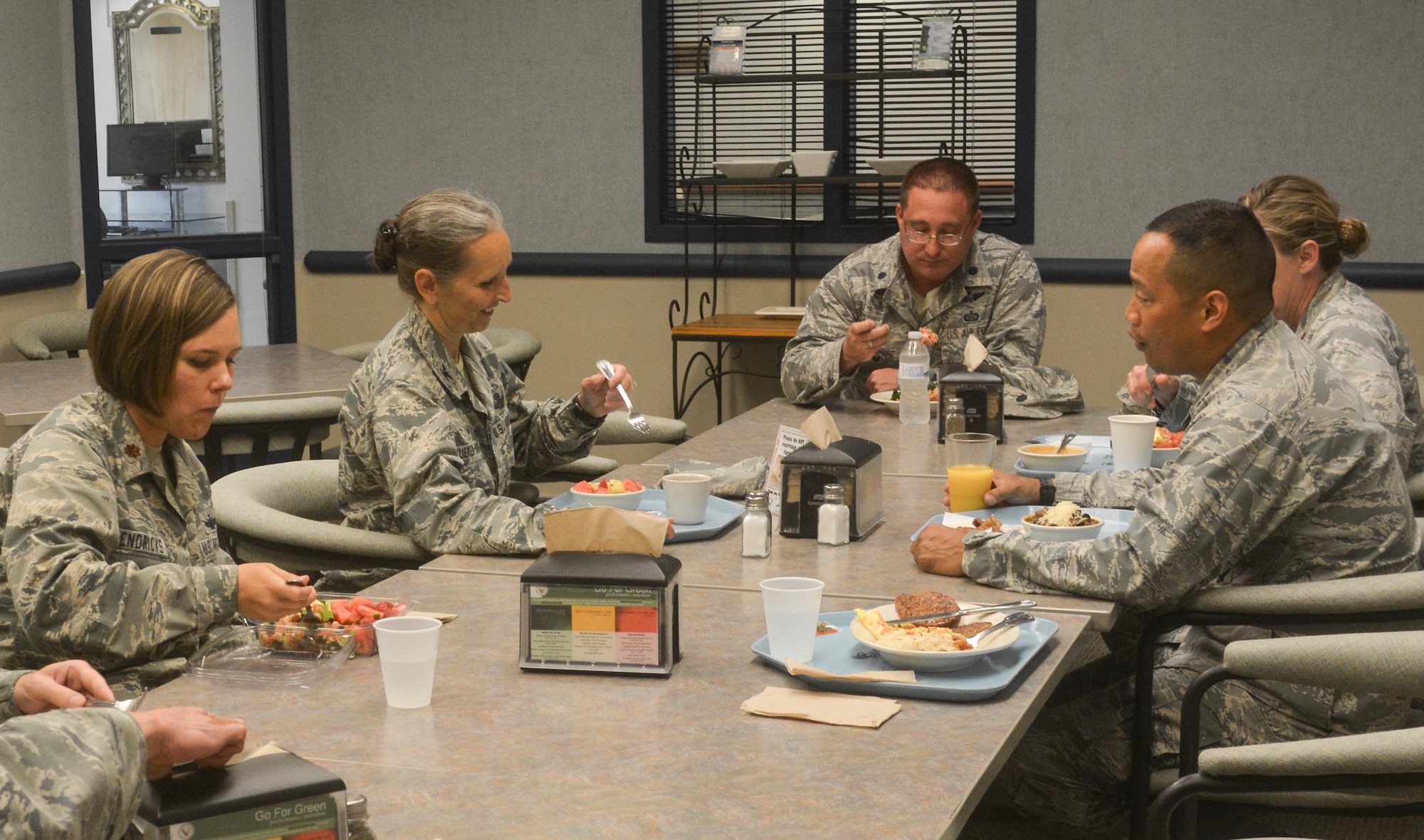 VANDENBERG AIR FORCE BASE, Cali. -- Col. Traci Kueker-Murphy, 310th Space Wing commander, visits with members of the 9th Combat Operations Squadron during an officers luncheon at the base dining facility on Sunday, July 9, 2017. Kueker-Murphy and Command Chief Master Sgt. Todd Scott visited 9 COS to get better insight of this geographically separated unit during the July Unit Training Assembly. (U.S. Air Force photo/Senior Airman Laura Turner)