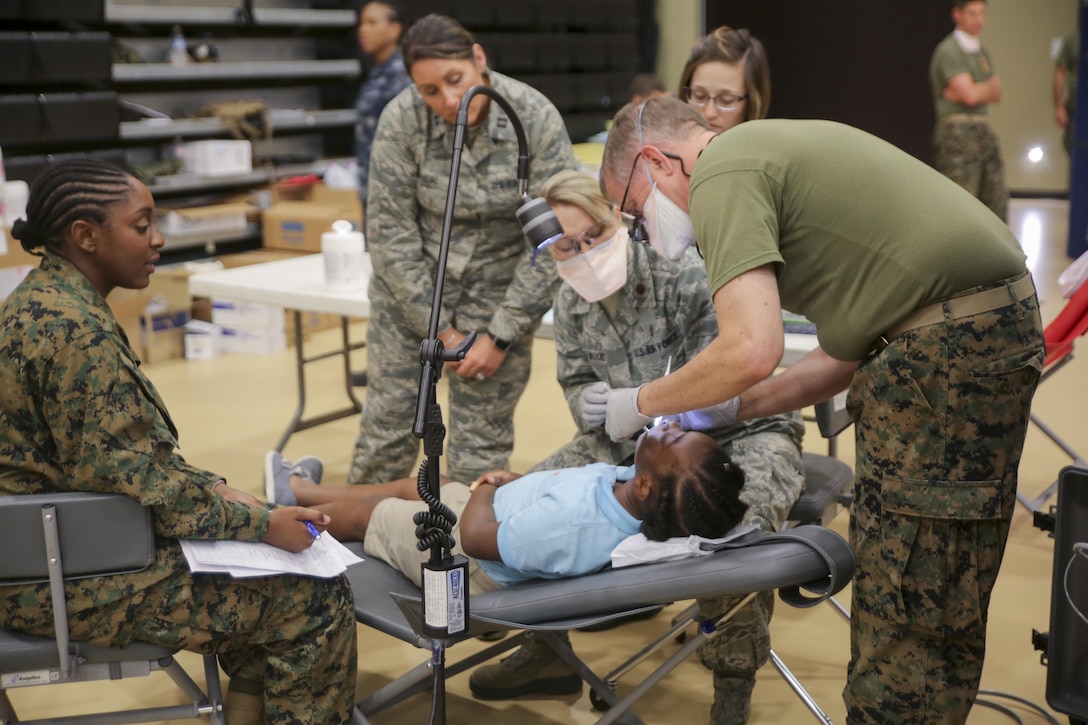 Air Force National Guardsmen and U.S. Navy personnel provide dental care during Innovative Readiness Training Louisiana Care 2017 at Assumption Community Center in Napoleonville, La., July 12, 2017. IRTs builds mutually beneficial civil-military partnerships between local communities and the military to provide high quality, mission essential training for service members and much needed medical care for civilians. (Photo by U.S. Marine Pvt. Samantha Schwoch/Released)