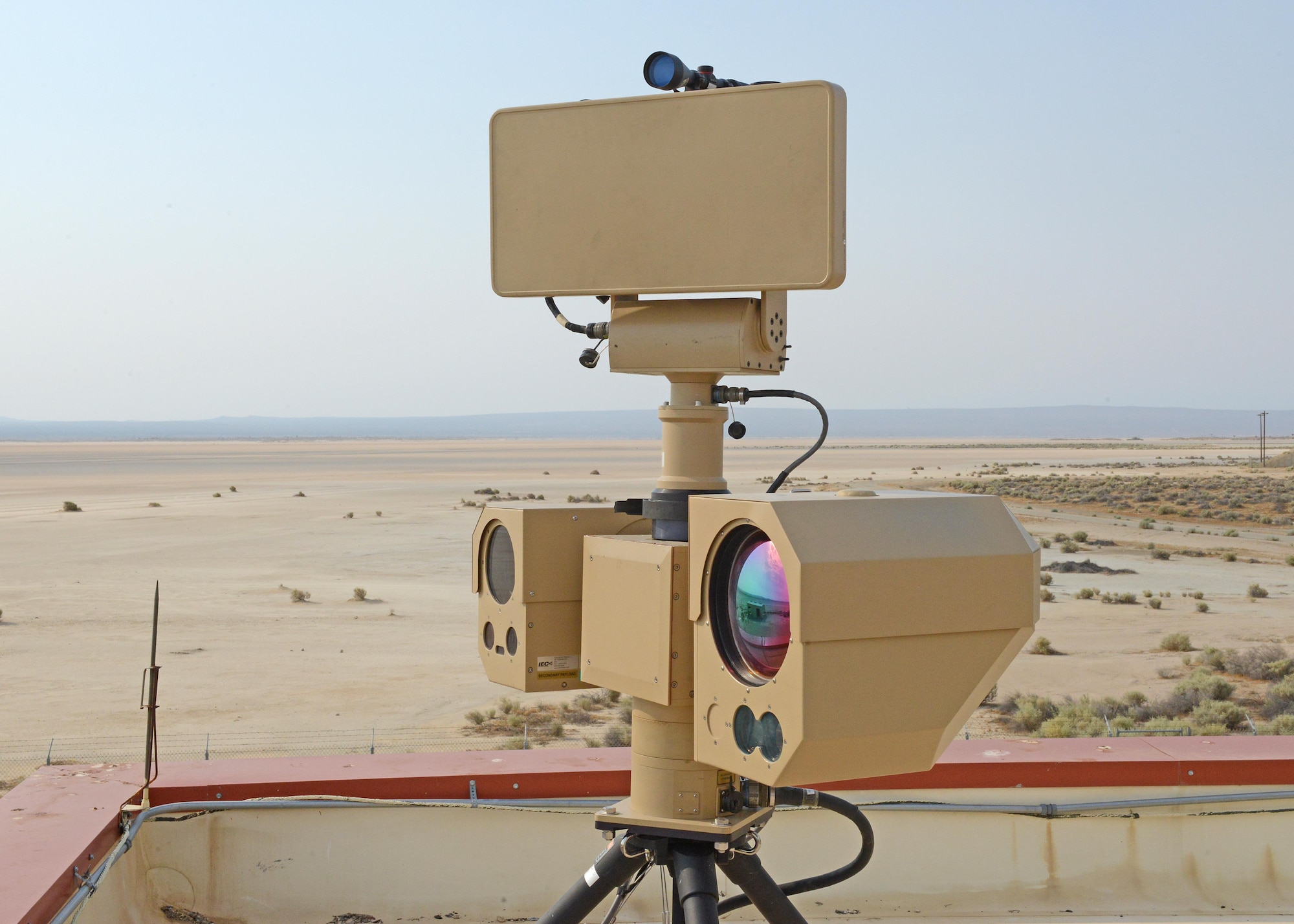 A private company set up their Raptor surveillance system at a remote building near the edge of Rogers Dry Lakebed July 10. The ground-based radar system has the capability to monitor the lakebed at great distances with electro-optical and infrared sensors. The 412th Test Wing will now decide whether to field the system. (U.S. Air Force photo by Kenji Thuloweit)