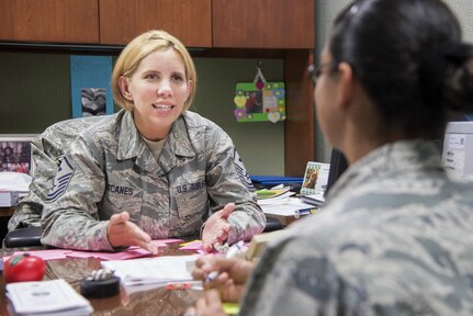 Master Sgt. Gina Escanes, 502nd Wing Staff Agency first sgt., counsels an Airman on the Air Force Fitness Program July 5, 2017, at Joint Base San Antonio-Fort Sam Houston, Texas.  Escanes’ mission is to assist commanders with all matters affecting health, morale, discipline, welfare and legal issues.