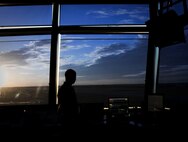 A 5th Operations Support Squadron air traffic control Airman watches the flight line at Minot Air Force Base, N.D., June 20, 2017. During any in-flight emergency, it’s an air traffic controller’s responsibility to get the aircraft safely on the ground by clearing the airspace, communicating with the aircrew and ensuring emergency personnel are prepared to meet the aircraft when it lands. (U.S. Air Force photo by Senior Airman Sahara L. Fales)