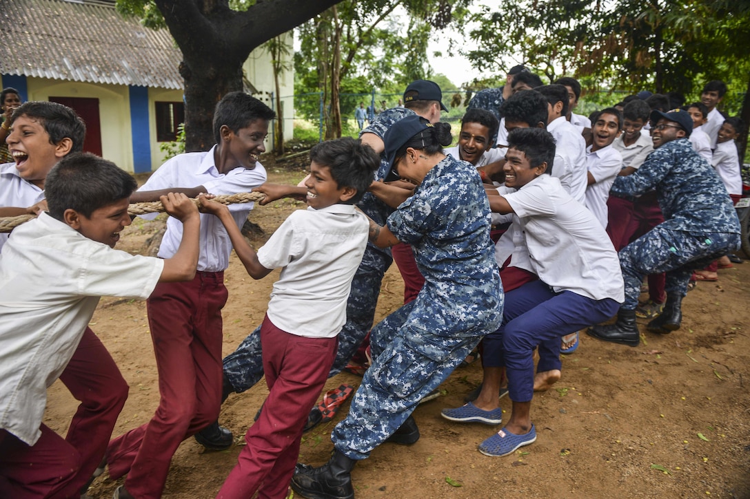 Sailors participate in a tug-of-war match with students from a secondary school in Chennai, India, July 12, 2017. The sailors, assigned to the Nimitz Carrier Strike Group, are participating in Exercise Malabar 2017 with Indian and Japanese forces. Navy photo by Petty Officer 2nd Class Erickson B. Magno
