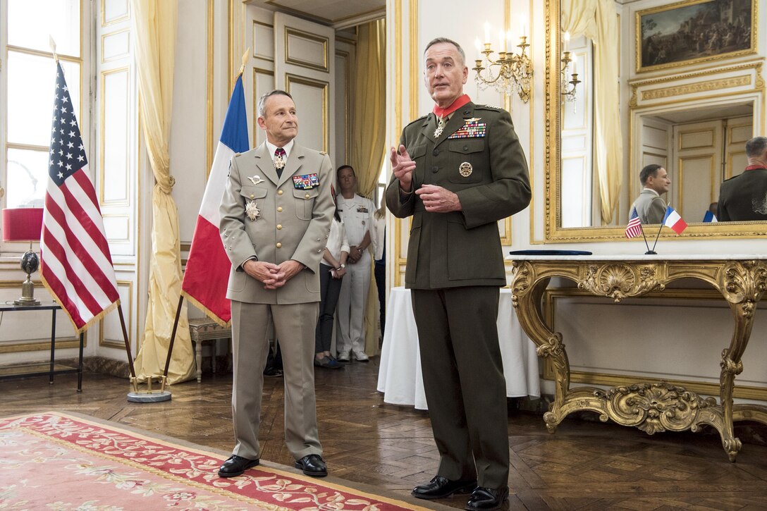 Marine Corps Gen. Joe Dunford, chairman of the Joint Chiefs of Staff, speaks after receiving the Legion of Honor from French Gen. Pierre de Villiers, chief of the French defense staff, in Paris, July 13, 2017. DoD photo by Navy Petty Officer 2nd Class Dominique A. Pineiro