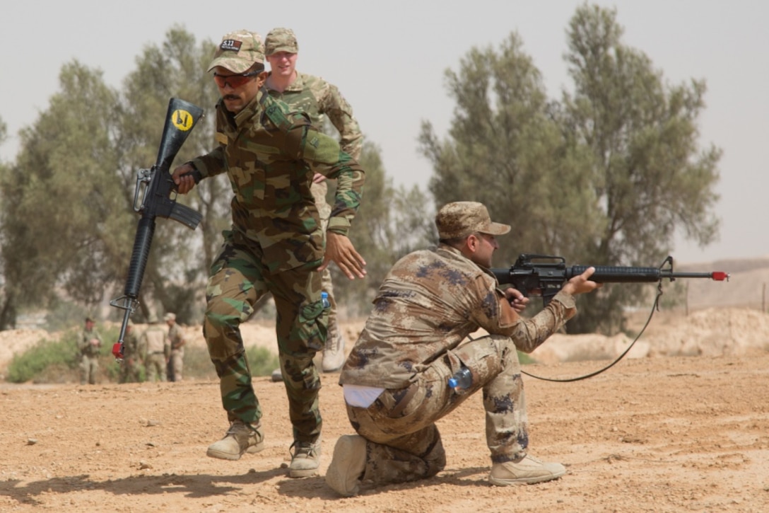 An Iraqi soldier rushes to regroup with his team as they return fire during a basic infantry class at Camp Al Asad, Iraq, July 4, 2017. The training is critical to enabling Iraqi forces to liberate their nation from the Islamic State of Iraq and Syria. Army photo by Spc. Cole Erickson