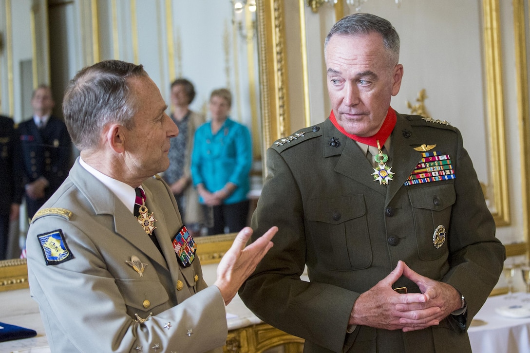 Marine Corps Gen. Joe Dunford, chairman of the Joint Chiefs of Staff, talks with French Gen. Pierre de Villiers, chief of the French defense staff, after receiving the Legion of Honor on the eve of Bastille Day in Paris, July 13, 2017. DoD photo by Navy Petty Officer 2nd Class Dominique A. Pineiro