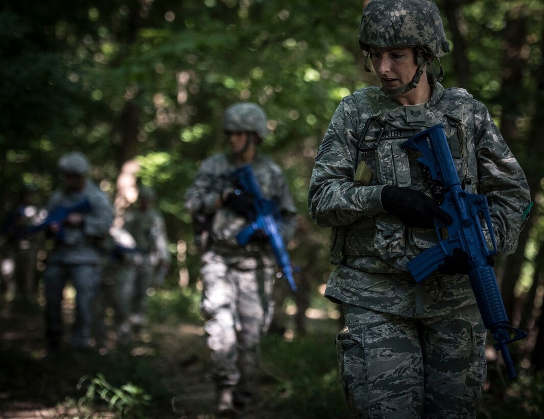 Staff Sgt. Zachary Webb is given a command from the patrol leader to hold up as information about possible improvised explosive device information is passed along the patrol, July 9, 2017, Scott Air Force Base, Illinois. During the July unit training assembly, 932nd Security Forces Airman conducted IED detection training.  (U.S. Air Force photo by Tech. Sgt. Christopher Parr)