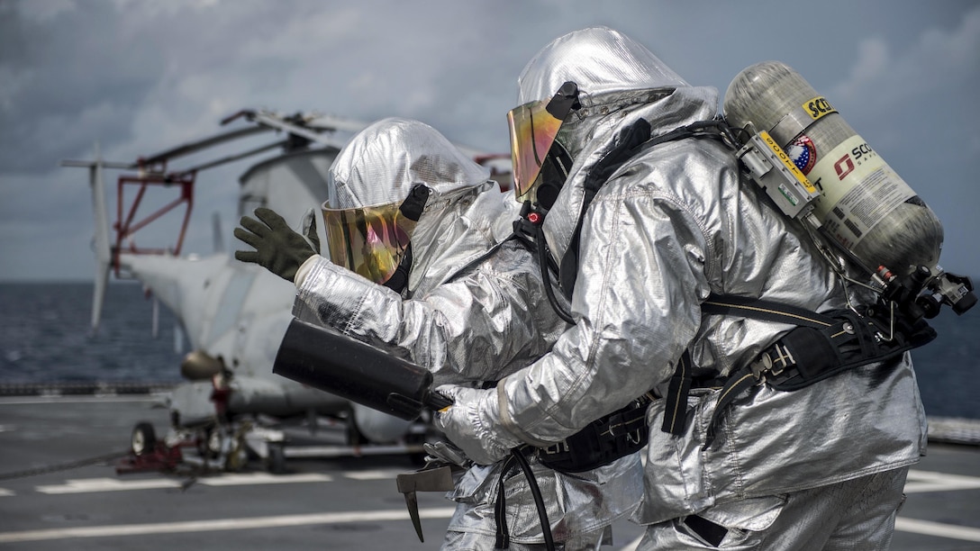 Sailors participate in an aircraft firefighting drill aboard the USS Coronado in the South China Sea, July 11, 2017. The Coronado is patrolling the region's littorals and working hull-to-hull with partner navies to provide the 7th Fleet with the flexible capabilities it needs now and in the future. Navy photo by Petty Officer 3rd Class Deven Leigh Ellis