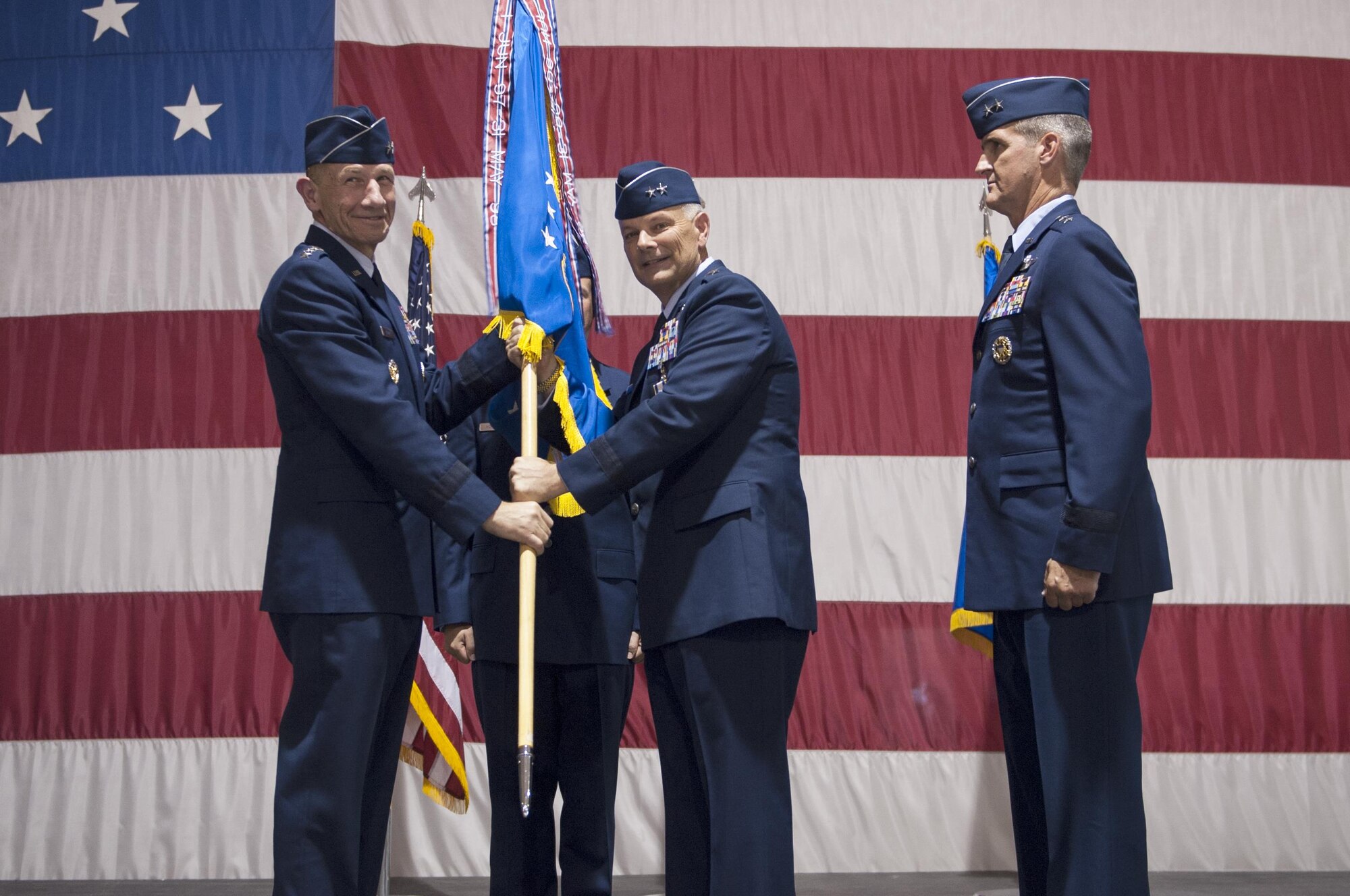 Gen. Mike Holmes, commander of Air Combat Command, poses with Maj. Gen. Glen VanHerck, commander of the U.S. Air Force Warfare Center during a change of command ceremony July 13, 2017 at Nellis Air Force Base, Nev. VanHerck transferred command of the USAFWC to Maj. Gen. Peter Gersten and will move on to a new assignment in Washington D.C. (U.S. Air Force photo by Senior Airman Joshua Kleinholz)