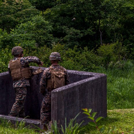 A U.S. Marine with Marine Wing Support Squadron (MWSS) 171, based out of Marine Corps Air Station Iwakuni, throws an M67 fragmentation grenade during phase two of Eagle Wrath 2017 at Combined Arms Training Center Camp Fuji, Japan, July 3, 2017. Phase two consisted of conducting live-fire training exercises to give MWSS-171 the knowledge and confidence to utilize weapons systems effectively in a deployed environment. (U.S. Marine Corps photo by Lance Cpl. Stephen Campbell)