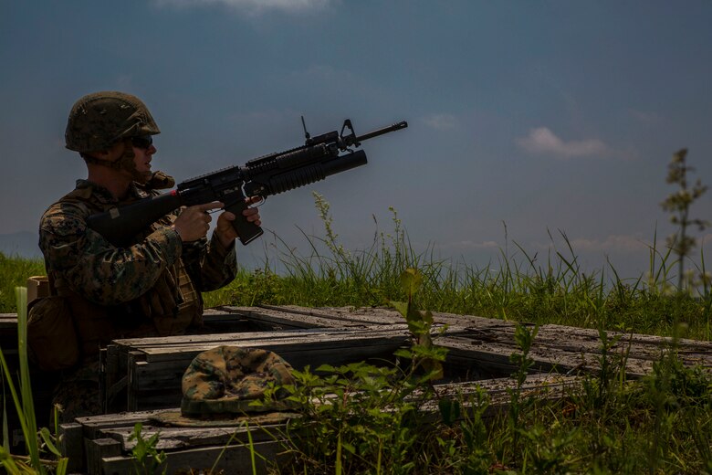 U.S. Marine Corps Pfc. Cody Burkhardt, a combat engineer with Marine Wing Support Squadron (MWSS) 171, based out of Marine Corps Air Station Iwakuni, shoots an M203 grenade launcher during phase two of Eagle Wrath 2017 at Combined Arms Training Center Camp Fuji, Japan, July, 10, 2017. Phase two consisted of conducting live-fire training exercises to give MWSS-171 the knowledge and confidence to utilize weapons systems effectively in a deployed environment. (U.S. Marine Corps photo by Lance Cpl. Stephen Campbell)