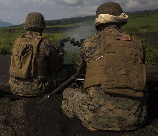 A U.S. Marine with Marine Wing Support Squadron (MWSS) 171, based out of Marine Corps Air Station Iwakuni, shoots a Mark 19 40 mm grenade machine gun during phase two of Eagle Wrath 2017 at Combined Arms Training Center Camp Fuji, Japan, July 7, 2017. Phase two consisted of conducting live-fire training exercises to give MWSS-171 the knowledge and confidence to utilize the weapons systems effectively in a deployed environment. (U.S. Marine Corps photo by Lance Cpl. Stephen Campbell)