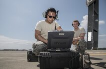 U.S. Air Force Staff Sgt. Sonethasinh Sayasaeng, left, shows Airman 1st Class Talon Cotterman, right, both 35th Maintenance Squadron avionics technicians, how to begin the M7.1 upgrade to an F-16 Fighting Falcon at Misawa Air Base, Japan, July 13, 2017. Both aircraft maintenance unit personnel are working together to simultaneously phase the 13th and 14th Fighter Squadrons’ fleet into the new upgrade by Aug. 1, enabling emerging pilots to receive a finer quality of training. (U.S. Air Force photo by Airman 1st Class Sadie Colbert)