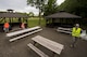 Airmen participating in Spangdahlem's Eifel Pride Program search for trash during a base cleanup at Spangdahlem Air Base, Germany, May 18, 2017. In between computer based trainings and appointments, Eifel Pride members are tasked with beautifying the base. Airmen walk in groups on designated routes to clean up trash and debris. (U.S. Air Force photo by Senior Airman Preston Cherry)