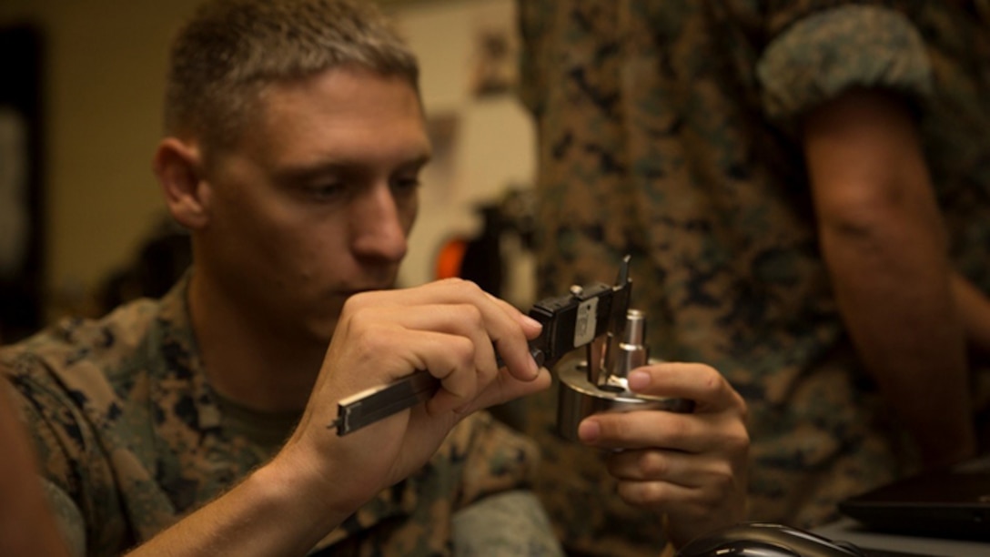 Sgt. Chris P. Tellef, a fire team leader with the Logistics Combat Element, Special Purpose Marine Air-Ground Task Force - Southern Command, measures a water jet nozzle during the 3-D Printing Training Course at Marine Corps Base Camp Lejeune, North Carolina, April 20, 2017. Marines from various sections of SPMAGTF-SC attended the two-day training hosted by General Support Maintenance Company, 2nd Maintenance Battalion, Combat Logistics Regiment 25, 2nd Marine Logistics Group, in order to gain hands-on experience with 3-D printers and receive instruction in computer-aided design, file creation and manufacturing.