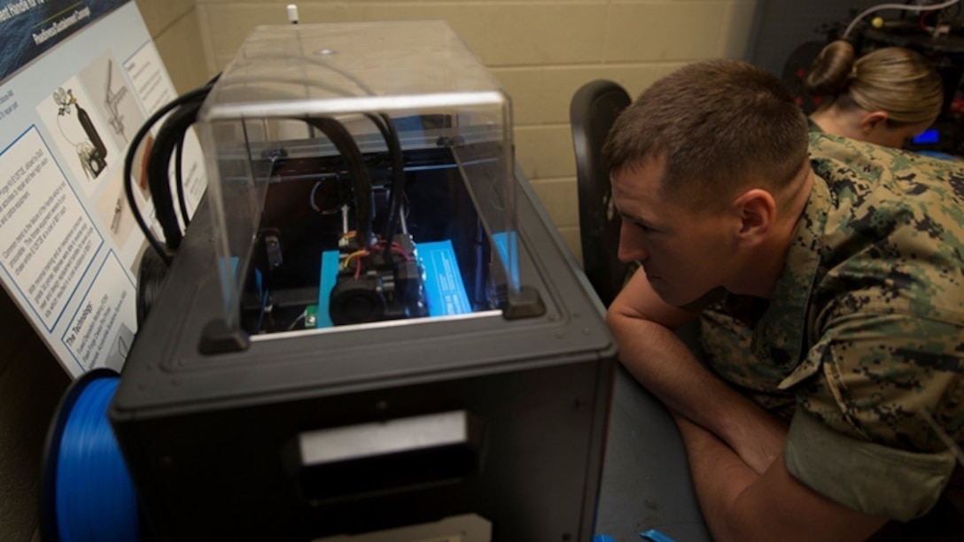 Sgt. Kenneth R. Storvick, a squad leader with the Logistics Combat Element, Special Purpose Marine Air-Ground Task Force - Southern Command, watches a three-dimensional printer create his design during the 3-D Printing Training Course at Marine Corps Base Camp Lejeune, North Carolina, April 20, 2017. Marines from various sections of SPMAGTF-SC attended the two-day training hosted by General Support Maintenance Company, 2nd Maintenance Battalion, Combat Logistics Regiment 25, 2nd Marine Logistics Group, in order to gain hands-on experience with 3-D printers and receive instruction in computer-aided design, file creation and manufacturing.