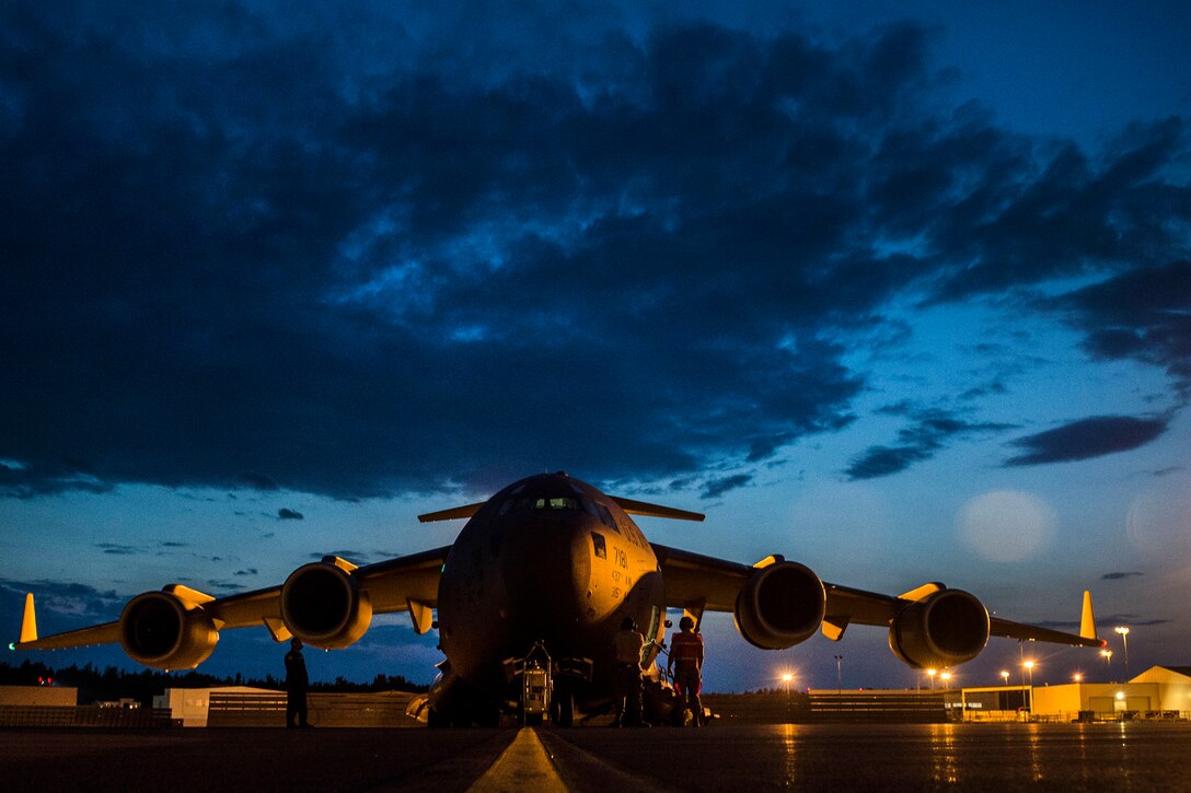 An Air Force C-17 Globemaster III sits on the ramp at Joint Base Elmendorf-Richardson, Alaska, July 12, 2017, before takeoff to provide airlift support for Exercise Talisman Saber 2017. The exercise improves U.S.-Australia combat readiness, increases interoperability, maximizes combined training opportunities and maritime prepositioning and logistics operations in the Pacific. Air Force photo by Tech. Sgt. Gregory Brook