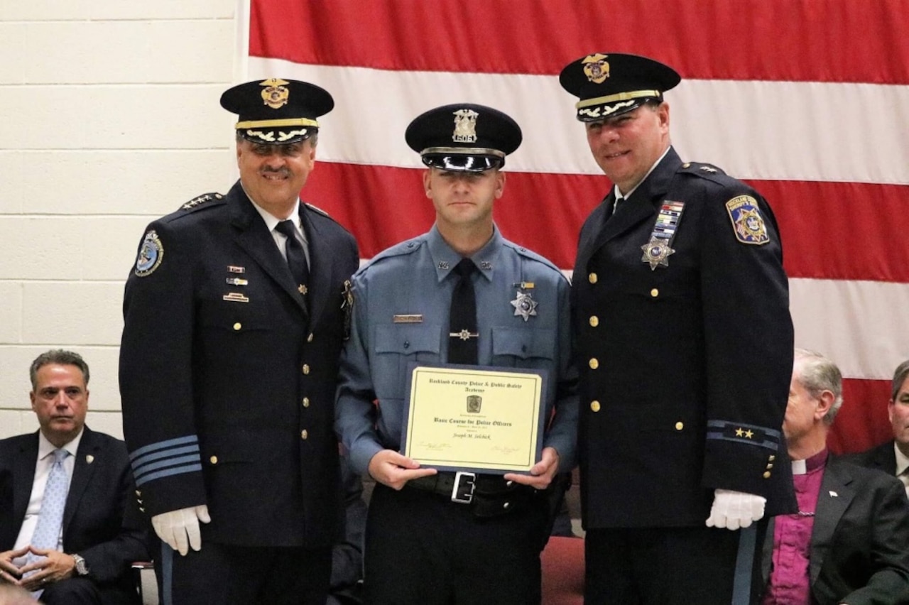Rockland County Sheriff Louis Falco, left, and Chief of Patrol William Barbera, right, congratulate New York Army National Guard Sgt. Joseph Selchick on his completion of the Rockland County Police and Public Safety Academy in Pomona, N.Y. on June 23, 2017. Selchick is a military police soldier with the National Guard’s 727th Military Police Law and Order Detachment and credits his military service for providing a foundation of experience for his success at the academy. New York Army National Guard by Col. Richard Goldenberg